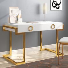 a white desk with gold legs in a room