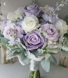 a bouquet of flowers sitting on top of a chair