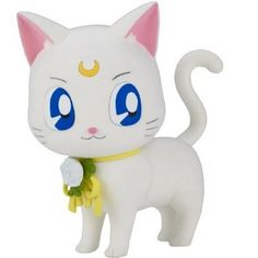 a white cat figurine with blue eyes and a yellow ribbon around its neck