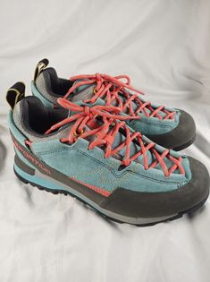 La Sportiva Women's Hiking Shoes Size 9. They seem to run small. I wear a 8 and they were a little  tight on me. Box has a tear and shelf wear but shoes are brand new. Please see photos. Blue Lace-up Walking Shoes With Ortholite Insole, Blue Lace-up Walking Shoes For Outdoor Activities, Blue Round Toe Walking Shoes, Blue Sneakers With Vibram Sole For Hiking, Blue Low-top Walking Shoes With Vibram Sole, Blue Walking Shoes With Vibram Sole And Round Toe, Blue Walking Shoes With Vibram Sole, Blue Lace-up Walking Shoes With Vibram Sole, Blue Round Toe Hiking Sneakers