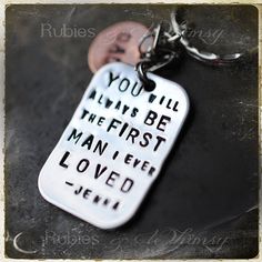 a keychain with the words you'll always be the first man i ever loved