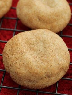 three cookies sitting on top of a cooling rack