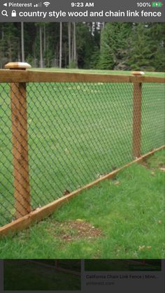 an image of a fence that is made out of wood and chain linked with wire