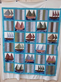 a quilt made to look like sailboats on the water