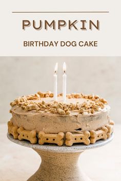 a birthday cake with two candles on it and the words pumpkin written in large letters