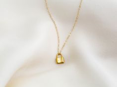 "Dainty lock necklace! The pendant is made of gold vermeil, which is heavy gold plating over sterling silver. Pair it with your favorite outfit! Layer with other necklaces, by or wear itself for a pop! . . . . . . . . . . . . . . . . . . . . . . . . . . . . . . . . . . . . . . . . . . NECKLACE + Length: 16\" + 2\" extender + Vermeil (18k gold plating over sterling silver) -or- sterling silver lock pendant: 8mm x 11mm + 14k gold filled -or- sterling silver chain, spring clasp, & findings LAYE Yellow Gold Chain Necklace With Gold Clasp As Gift, Everyday Gold Lock Jewelry, Everyday Gold Jewelry With Lock Detail, Gold Lock Necklace As Gift, Gold Chain Necklace With Lock For Gift, Yellow Gold Necklace With Lock As Gift, Lock Charm Necklace, Necklace Lock, Padlock Necklace