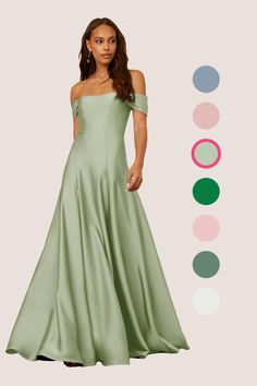 a woman in a long green dress standing next to an assortment of color swatches