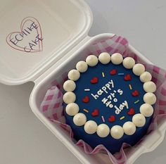 a birthday cake in a plastic container with the words happy birthday to you on it