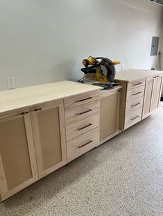 a workbench with drawers and a circular saw