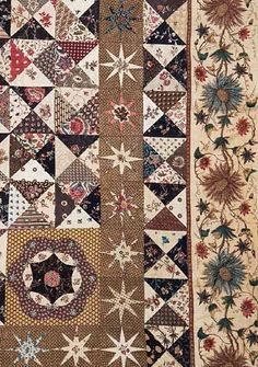 an old quilt with many different designs on it