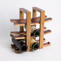 a wine rack made out of wood with bottles in it