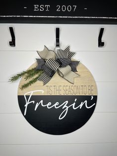 a sign that says, tis the season to be freegin'hanging on a wall