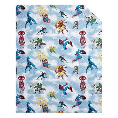 a blue wrapping paper with superheros and snowflakes on the bottom, in various colors