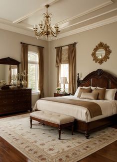 a bedroom with a large bed, dresser and mirror in it's center area