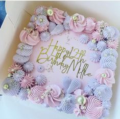 a pink and purple birthday cake in a box with the words happy birthday me written on it