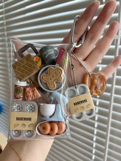 a person's hand holding a bag full of assorted items