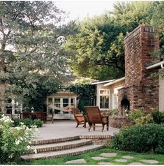 an outdoor patio with steps leading up to the house