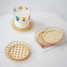 three wicker coasters on a white table