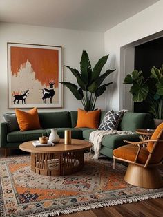 a living room with green couches and orange pillows on top of it's rug