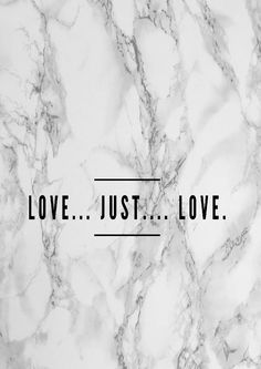 marble with the words love just love in black and white letters on it's side