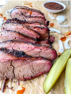 sliced beef is shown on a cutting board