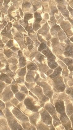 an image of sand and water that looks like waves