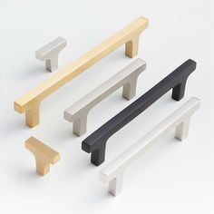 four different types of handles are shown in various colors and shapes, including black, white, yellow, and grey