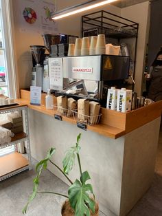 there is a coffee shop with many items on the counter and in front of it