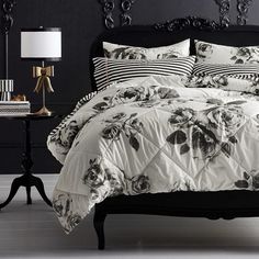 a black and white bed with flowers on it