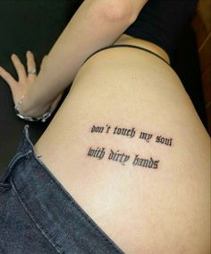 a woman with a tattoo saying don't touch my soul