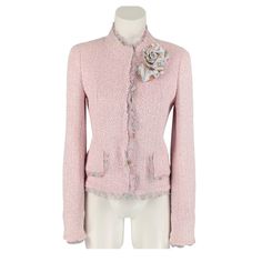 Chanel 2004 Jacket Comes In A Pink Boucle Polyamide Blend With A Full Print Liner Featuring A Heart & Camellia Pin, Logo Buttons, Silk Ice Cream Trim, Flap Pockets, And A Buttoned Closure. Made In France. Excellent Pre-Owned Condition. Tag Has Writing On It. Estimated Item Measurements: Bust: 33" Waist: 28" Length: 23" Fabric: 55% Polyamide, 33% Cotton, 5% Rayon, 4% Wool, 3% Linen Chanel Jackets, Cream Trim, Chanel Jacket, Trim Jacket, Pin Logo, Cream Silk, Raw Edge, A Heart, Blazer Suit