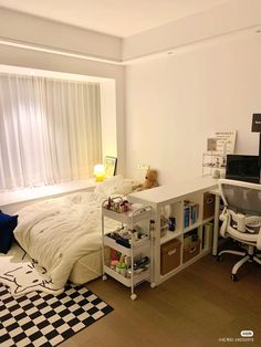 a bed room with a neatly made bed and desk