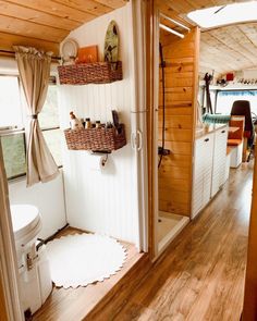 the inside of a tiny home with wood flooring and white walls, along with wooden floors