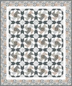 a black and white quilt with an orange border