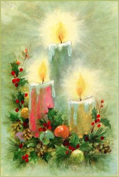 two lit candles surrounded by holly and other christmas decorations on a green background with red berries