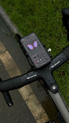 an electronic device attached to the handlebars of a bicycle