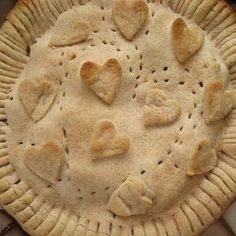 a pie with heart shaped cookies on it