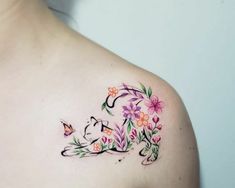 a woman's shoulder with flowers and butterflies on her left side, which has the letter e in it