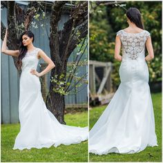 a woman in a wedding dress standing next to a tree