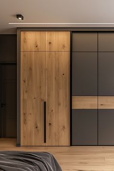 a bedroom with a bed and wooden cabinets