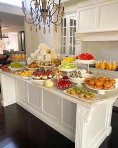 a buffet table filled with different types of food and drinks on it's sides