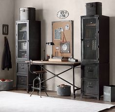 a room with an old fashioned desk and metal lockers