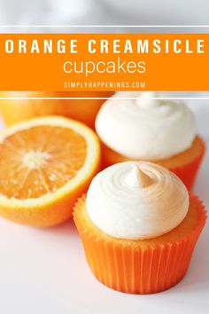 orange creamsicle cupcakes with white frosting and an orange slice on top