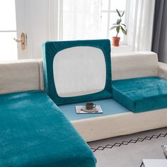 a living room with two couches and a tv on the end table in front of it