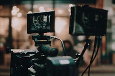 a video camera set up in front of a building