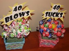 two baskets filled with candy sitting on top of a wooden table next to each other