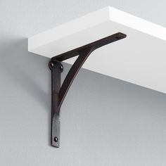 a shelf that has some metal brackets on it