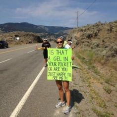 a woman holding a sign that says is that gel in your pocket or are you just happy to get here?