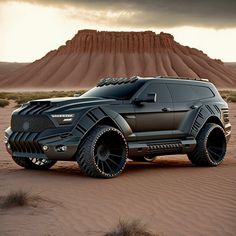 a black suv is driving through the desert