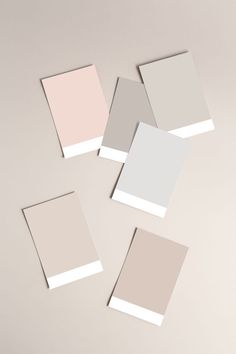 four different shades of gray, pink and white